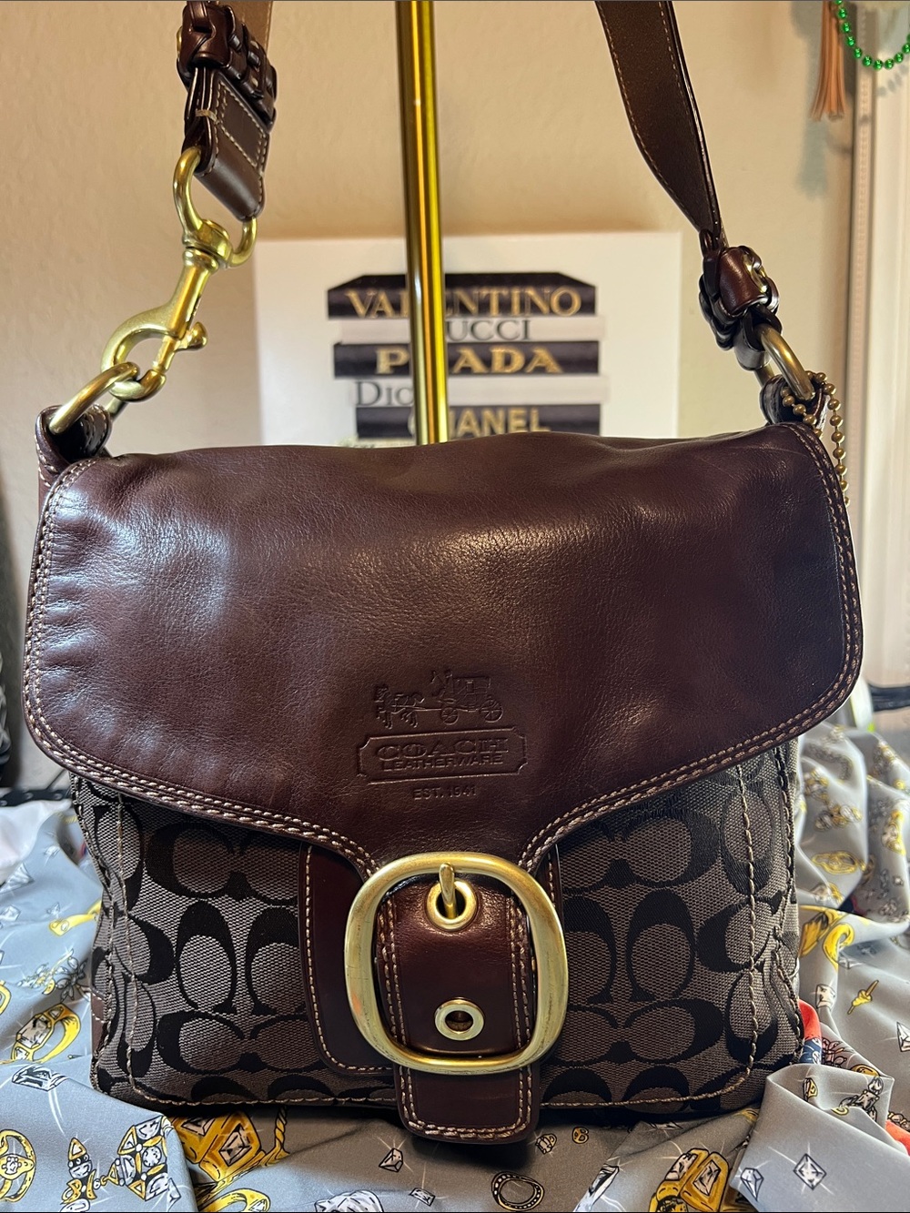 Coach “Bleecker” shoulder bag with leather flap & signature C canvas body.